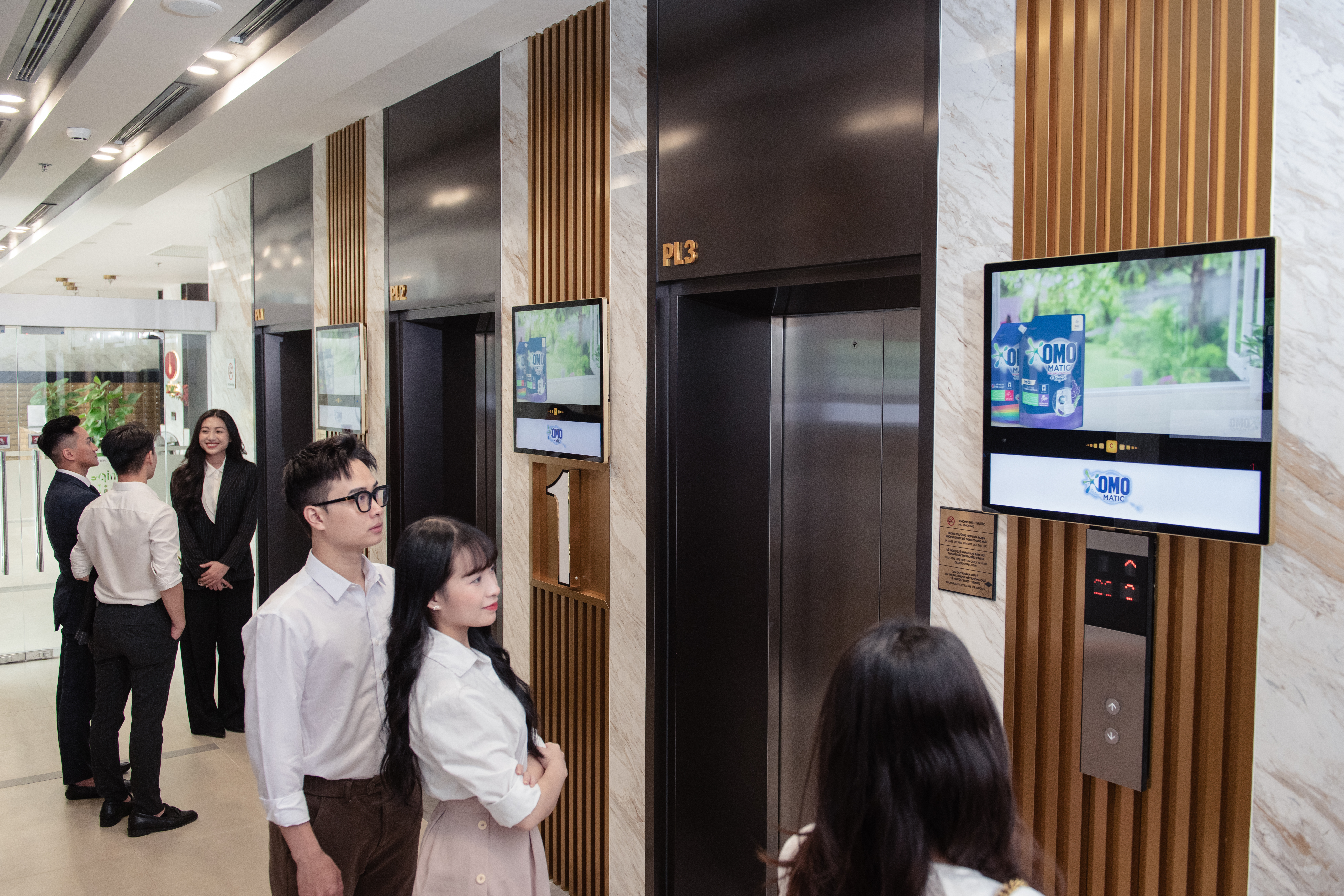 Screens in the elevator lobby